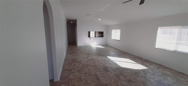 spare room featuring ceiling fan and lofted ceiling