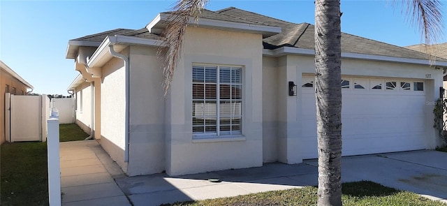 view of side of home with a garage