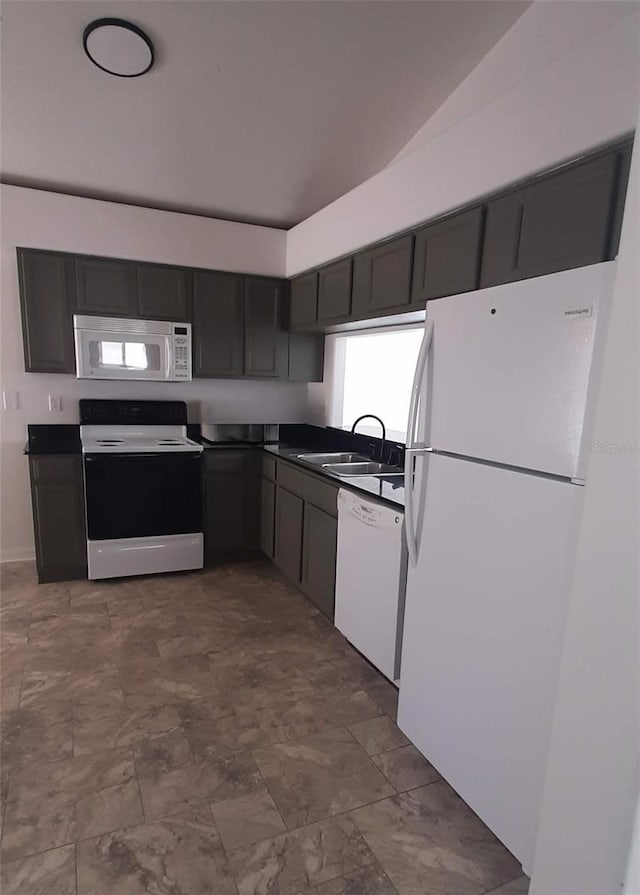 kitchen featuring vaulted ceiling, white appliances, and sink