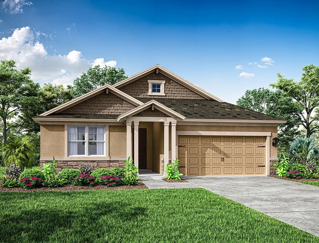 view of front of property with a garage and a front lawn