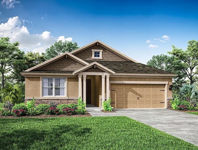 view of front of property with a garage and a front lawn