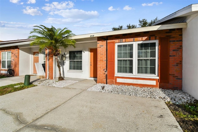 property entrance with a patio area