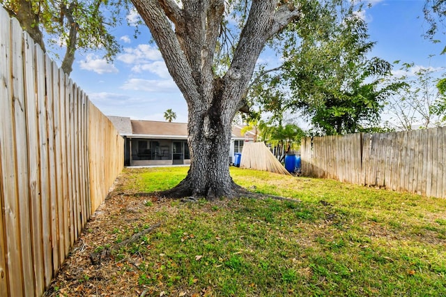 view of yard featuring a sunroom