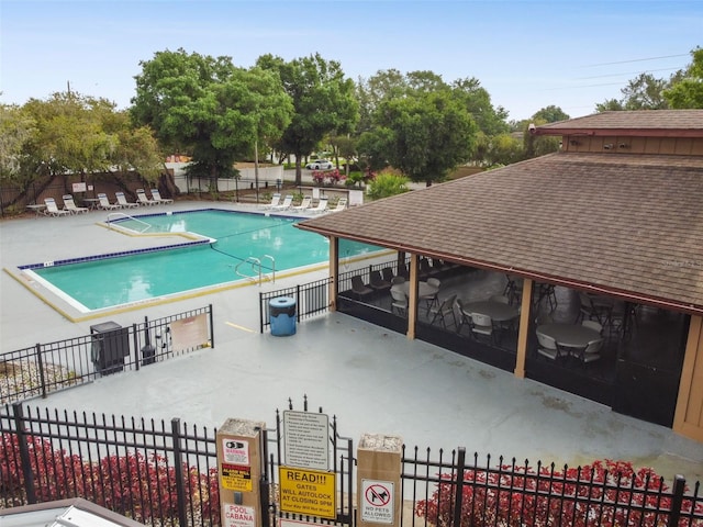 view of swimming pool with a patio