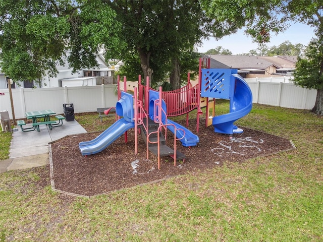 view of play area with a yard and a patio