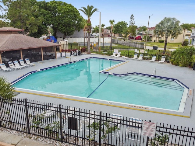 view of swimming pool featuring a patio area