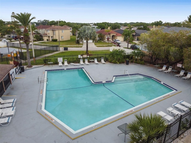 view of swimming pool featuring a patio area