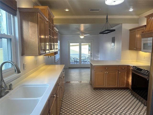 kitchen featuring sink, stainless steel range with electric stovetop, decorative light fixtures, ornamental molding, and kitchen peninsula