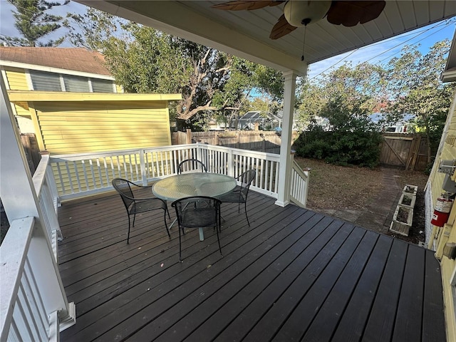 wooden terrace featuring ceiling fan