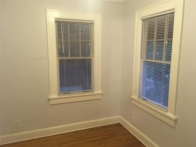 empty room with dark wood-type flooring