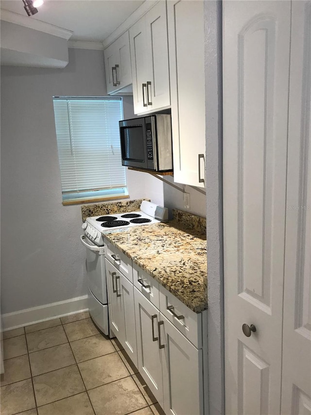 kitchen featuring white electric range, white cabinets, ornamental molding, light tile patterned floors, and light stone countertops