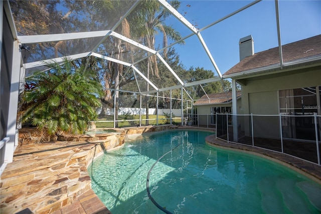 view of pool with a lanai and a patio area