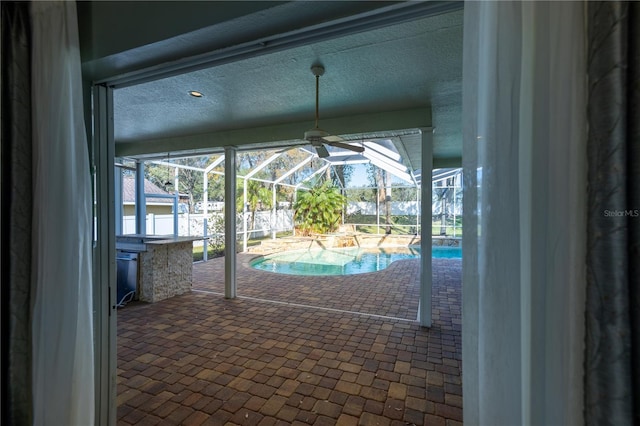 view of swimming pool with ceiling fan