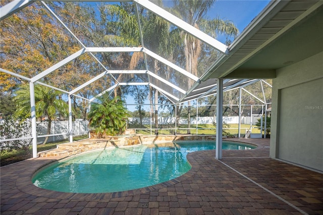 view of swimming pool with a lanai and a patio