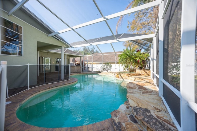 view of pool with a lanai and a patio