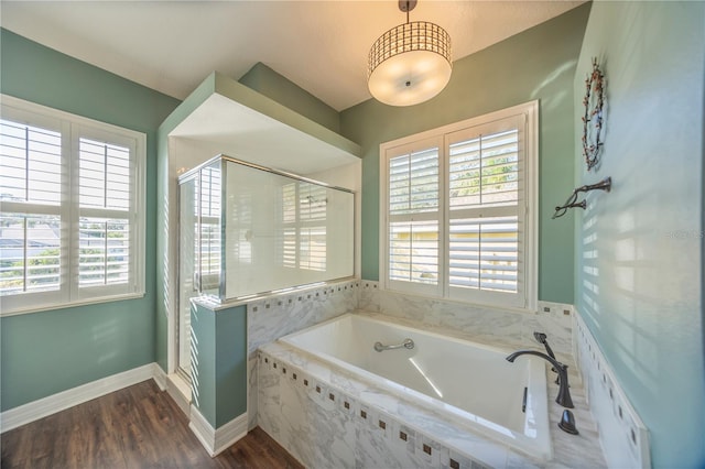 bathroom with wood-type flooring and separate shower and tub