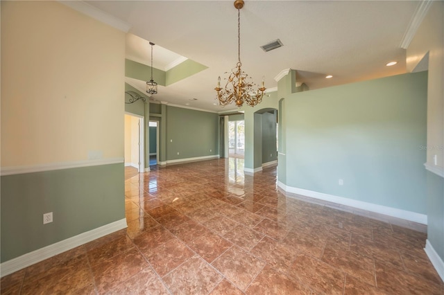 unfurnished room with crown molding and a notable chandelier