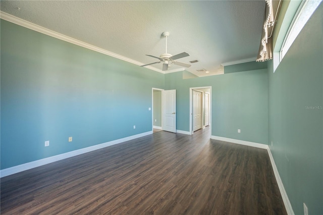 spare room featuring dark hardwood / wood-style flooring, ceiling fan, crown molding, and a textured ceiling