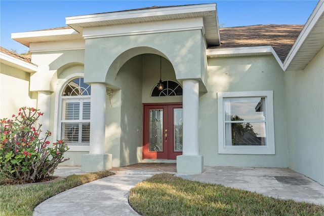 property entrance featuring french doors