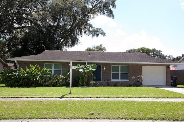 ranch-style house with a front lawn and a garage