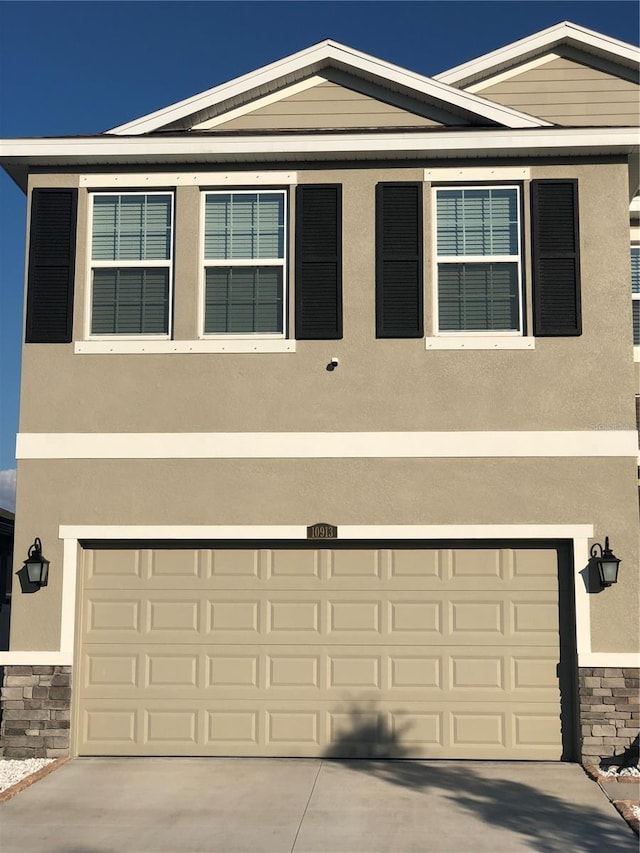 view of front of home with a garage