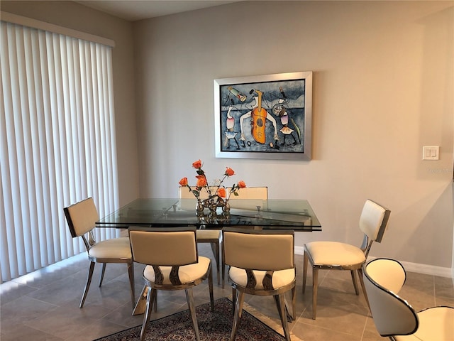 dining space featuring tile patterned floors