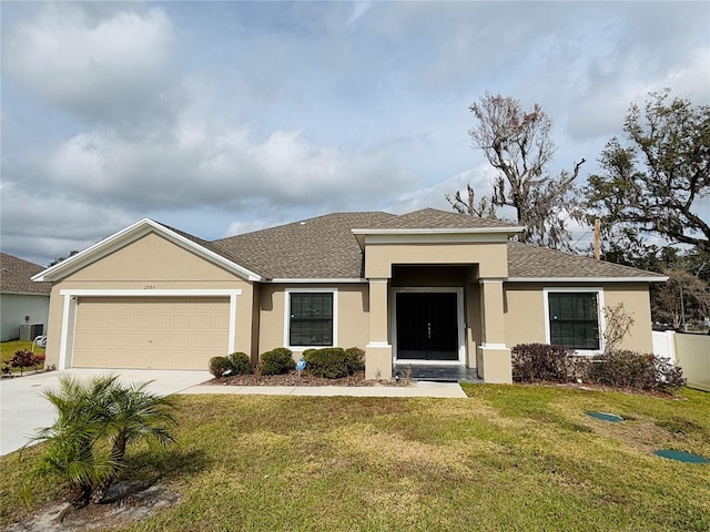 view of front of house with cooling unit, a front yard, and a garage