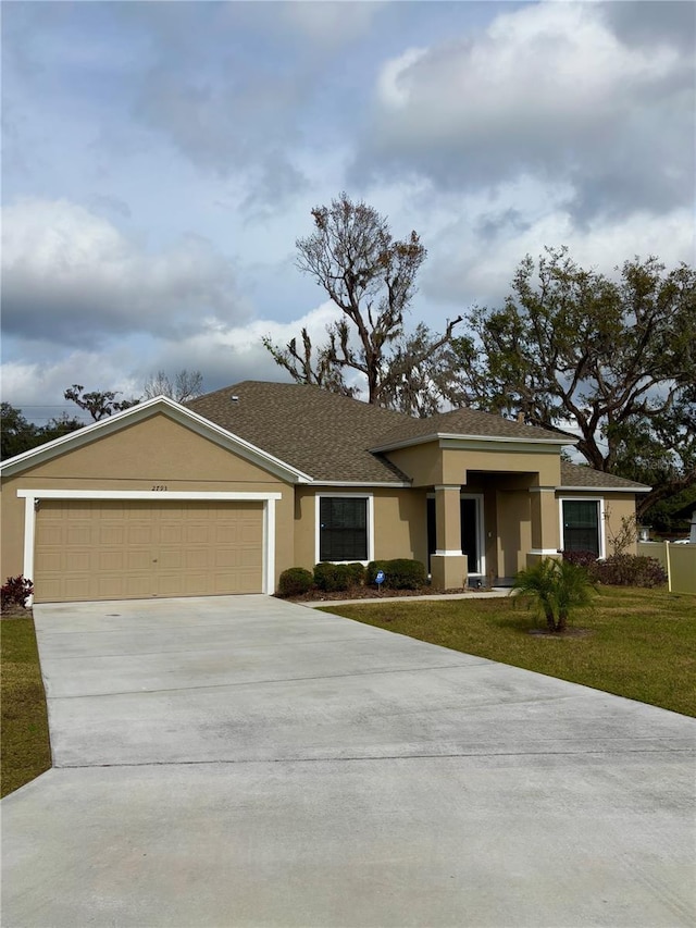 single story home with a garage and a front yard