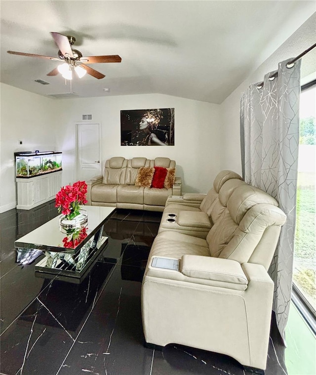 living room with ceiling fan and lofted ceiling