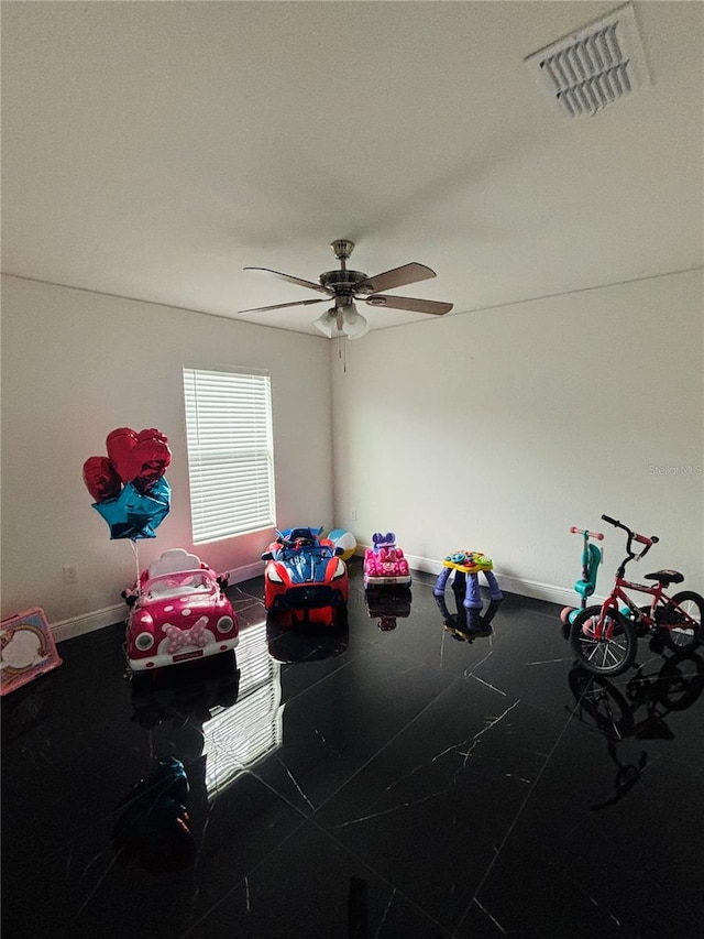 miscellaneous room featuring ceiling fan