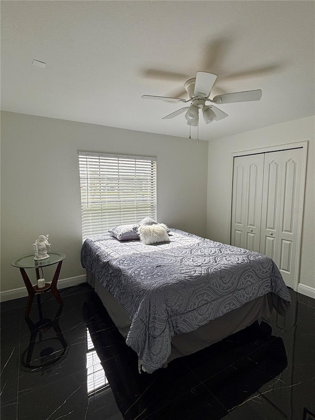 bedroom featuring a closet and ceiling fan