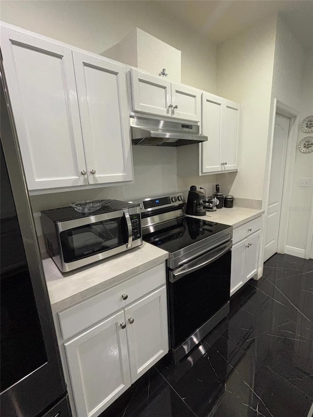 kitchen featuring white cabinets and stainless steel appliances