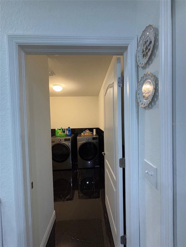 washroom with washer and clothes dryer