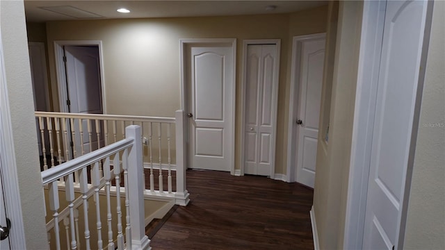 hall with dark hardwood / wood-style floors