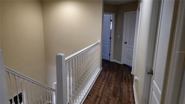 hall with dark wood-type flooring