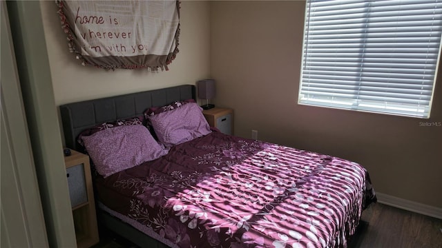 bedroom featuring wood-type flooring