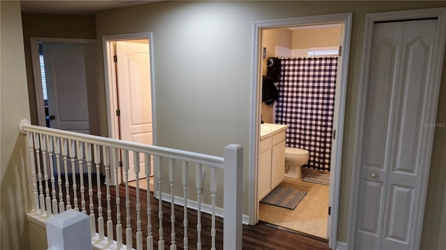 corridor featuring dark hardwood / wood-style flooring