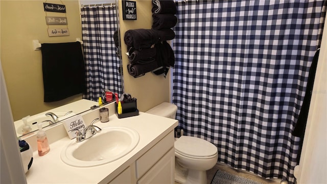 bathroom with vanity and toilet