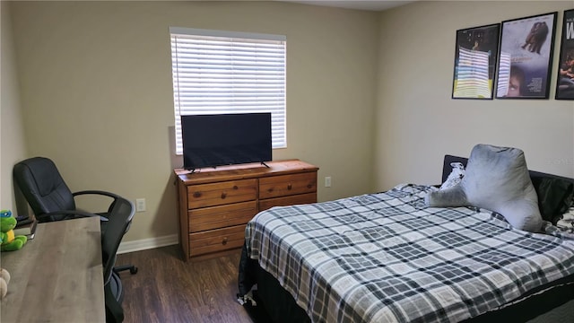 bedroom featuring dark hardwood / wood-style flooring