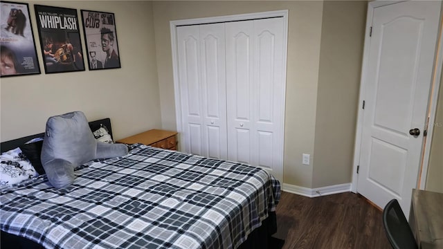 bedroom featuring dark hardwood / wood-style floors and a closet