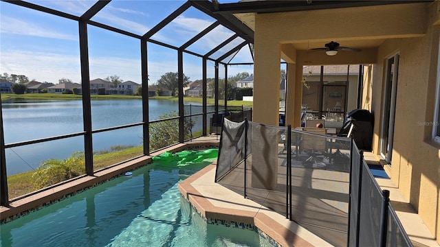 exterior space with a water view and a pool