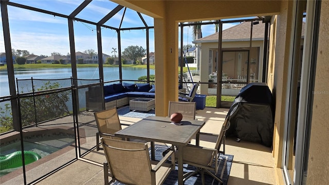 sunroom with a water view