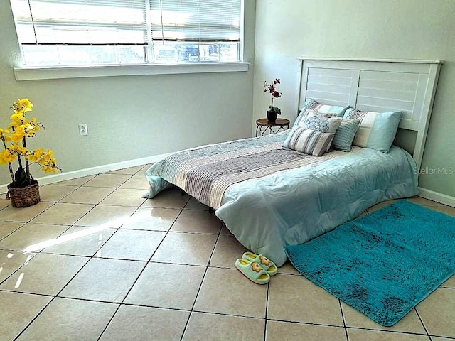 bedroom featuring tile patterned floors