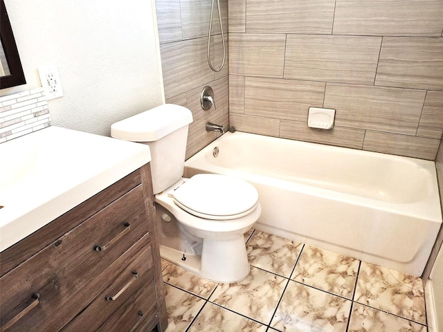 full bathroom featuring vanity, toilet, and tiled shower / bath combo