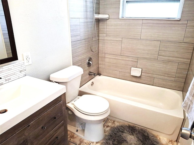 full bathroom with tiled shower / bath combo, vanity, tasteful backsplash, and toilet