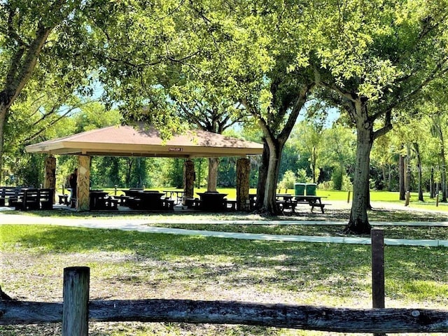 view of property's community with a gazebo and a yard