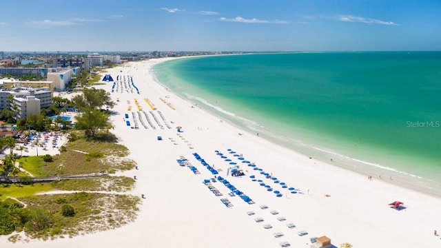 birds eye view of property featuring a view of the beach and a water view