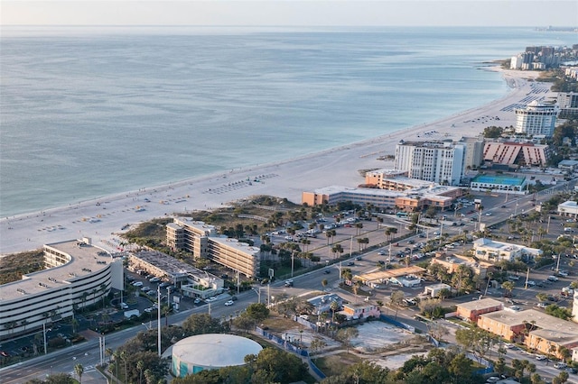 aerial view with a water view and a view of the beach