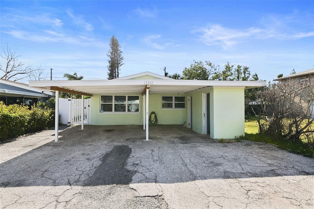 exterior space featuring a carport