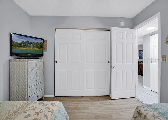 bedroom featuring a closet and light hardwood / wood-style flooring